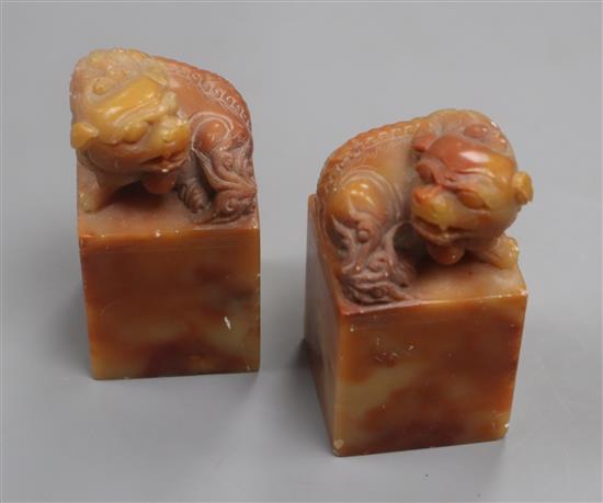 A pair of Chinese soapstone lion-dog seals height 7cm